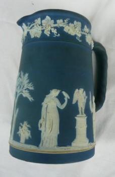 Blue jug with white figurines Blue jug with white figurines