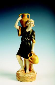 A man carrying jugs A man carrying jugs