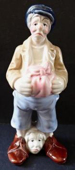 Statue of a man with his head at his feet Statue of a man with his head at his feet