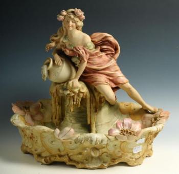 A ceramic bowl with a female and water lilies A ceramic bowl with a female and water lilies